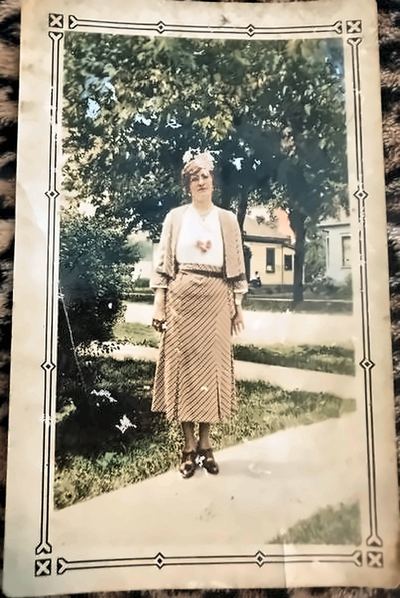 Enhanced (AI-assisted, non-generative): glare reduced, cleaned and upscaled. "Mother Proeger" — Anna Blanche (Roberts) Proeger, on a sidewalk at Wallaceburg, Ontario, Sunday 12 June 1932 (front of the inscribed snapshot)