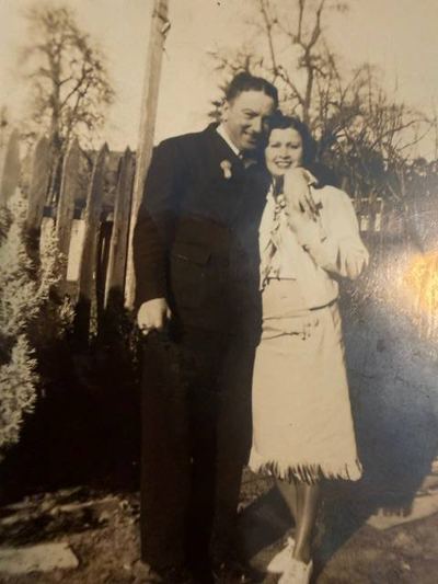 Mildred A. (Rose) Silva Springer and her second husband William Springer, by a picket fence, 1930s–1940s — from the Patricia Collins collection