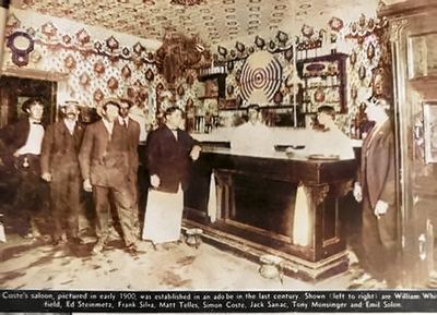 Restored (AI-assisted colour; faces from the original): descreened, cleaned, upscaled 3x and colourized. Coste's saloon, Mission San José — Frank Da Silva Jr (third from left), its speakeasy owner per family; c. 1920–1924 — newspaper clipping annotated 'Grandpa Silva / Mom's Dad', c. 1920–1924